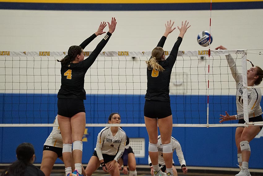 Volleyball Players Blocking Ball